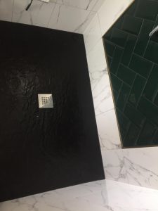 Black art deco shower basin floor in Brighton